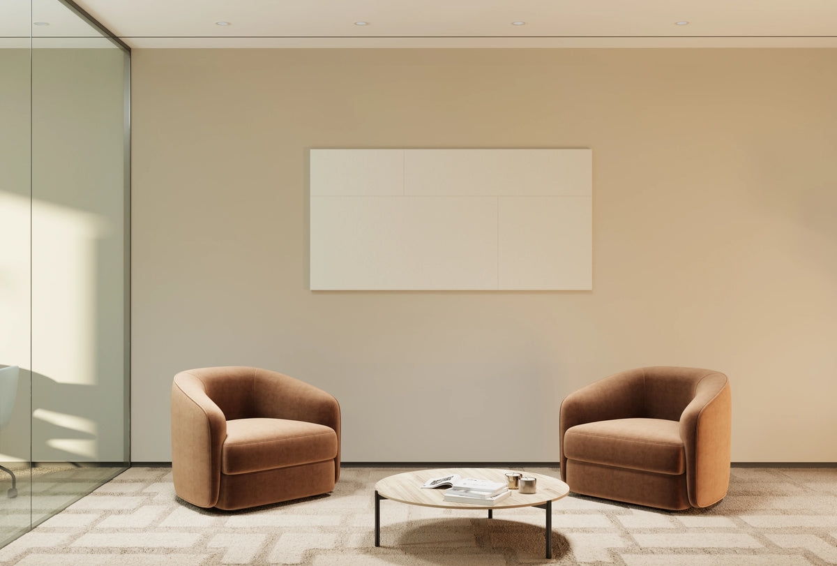 Two brown armchairs with a small round table in a modern room.